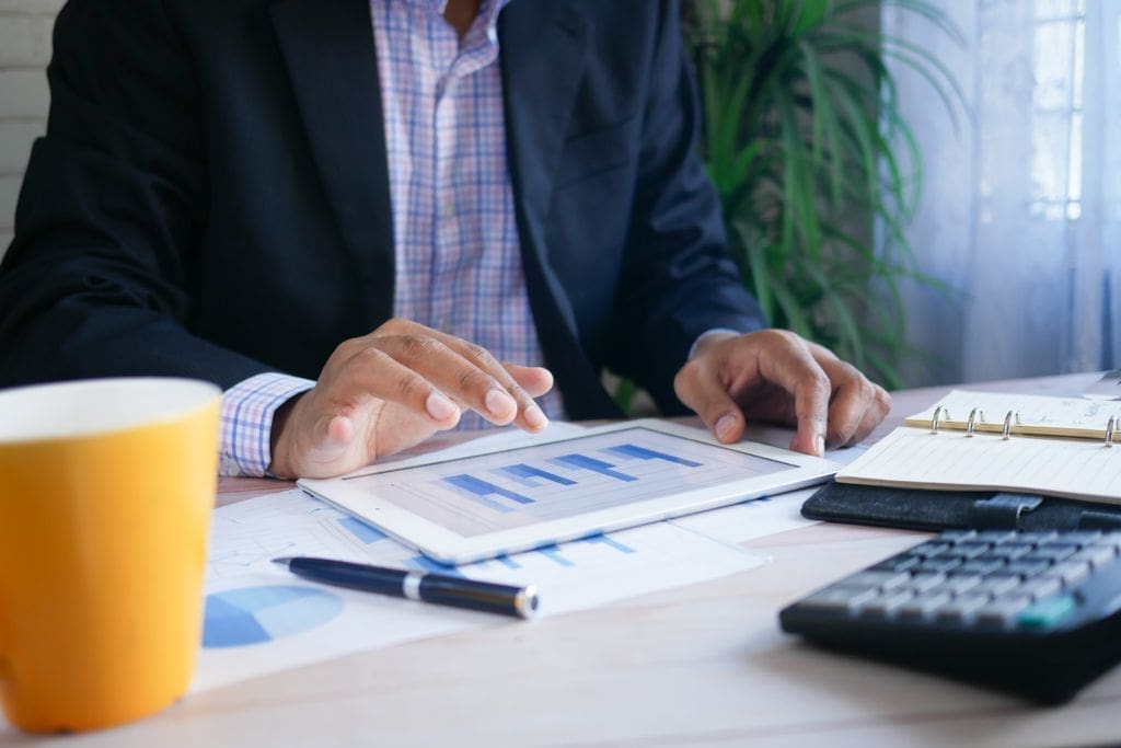 Small business owner reviewing financial reports to understand common accounting myths.